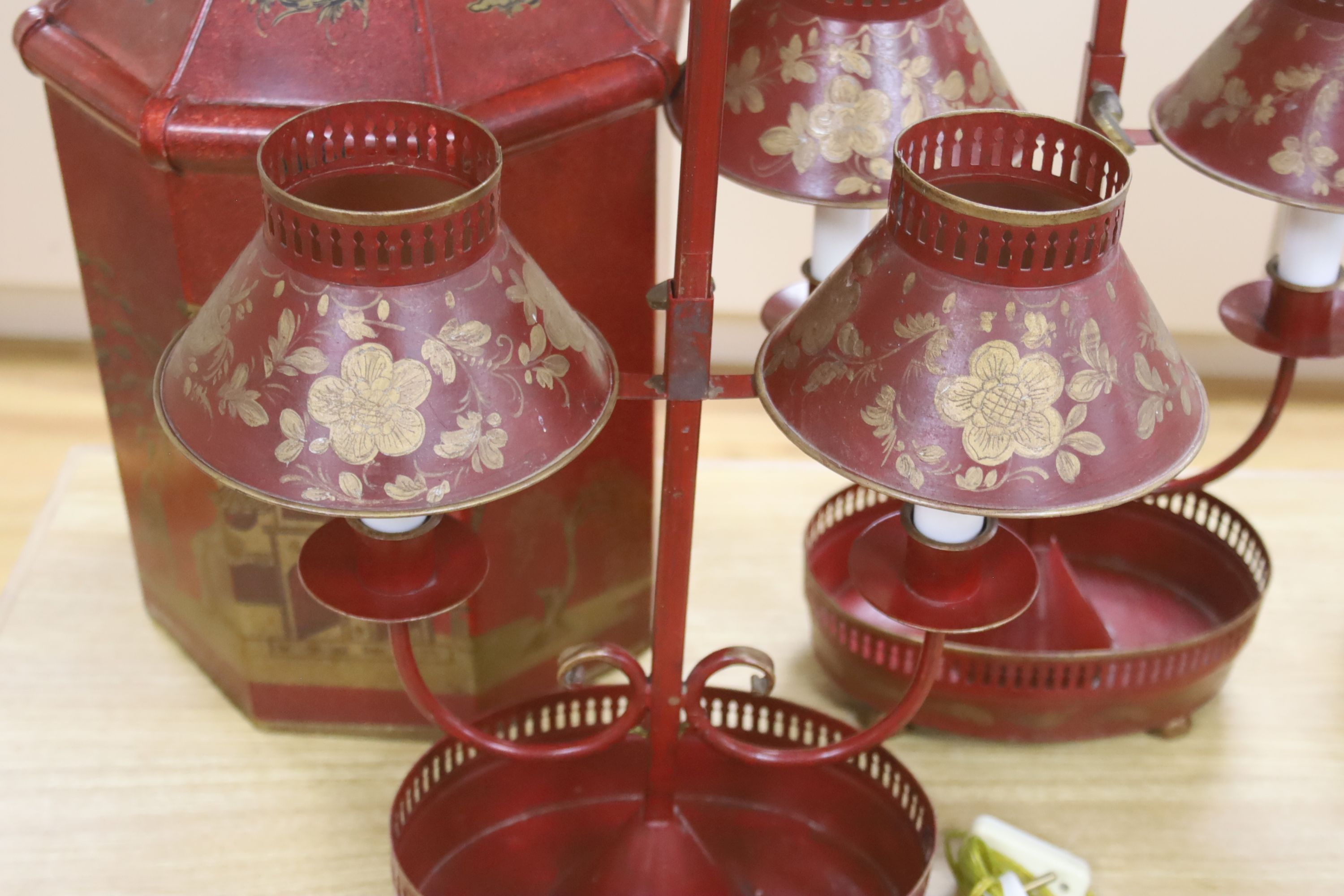 A pair of toleware student's lamps and one other, height 52cm excl. light fitting